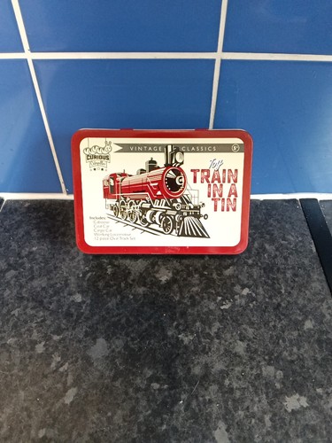 Toy train tin track set - in, a